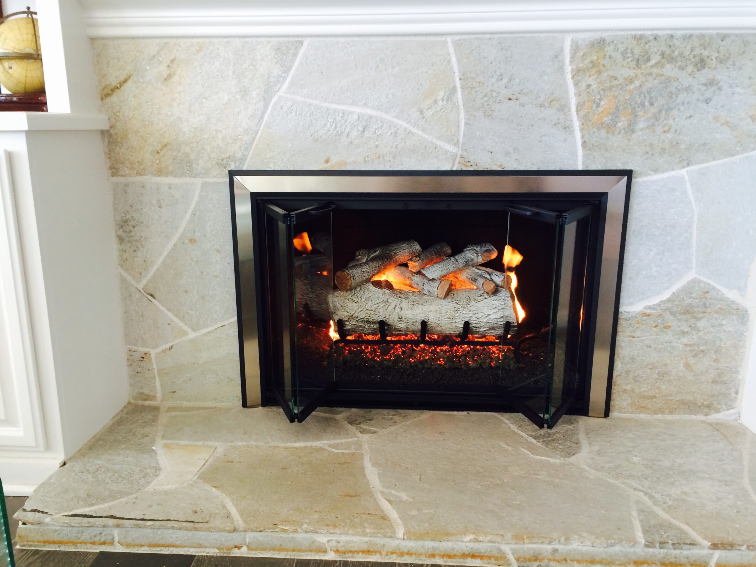 Stone fireplace with crackling fire