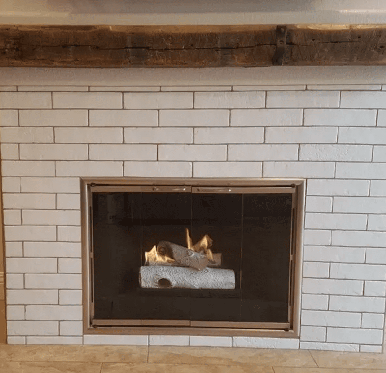 Cozy fireplace with logs and flames